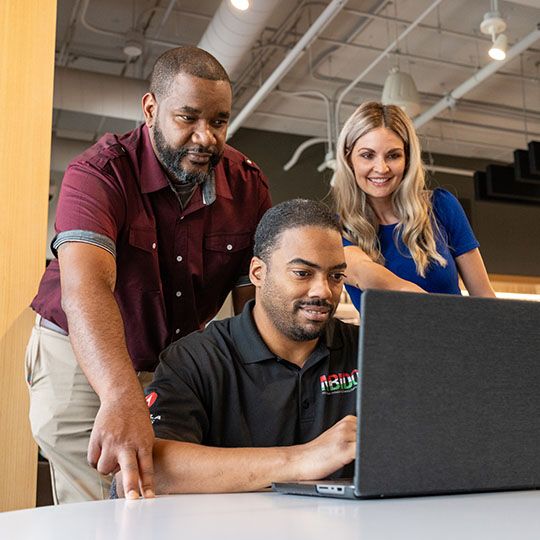 peoples looking at laptop screen