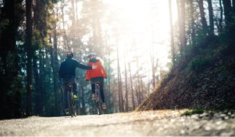 People biking in woods