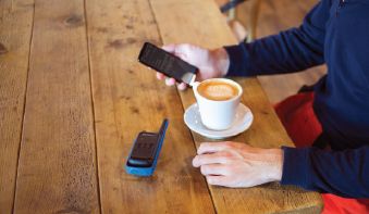 Blue t800 on ski lodge table with smartphone