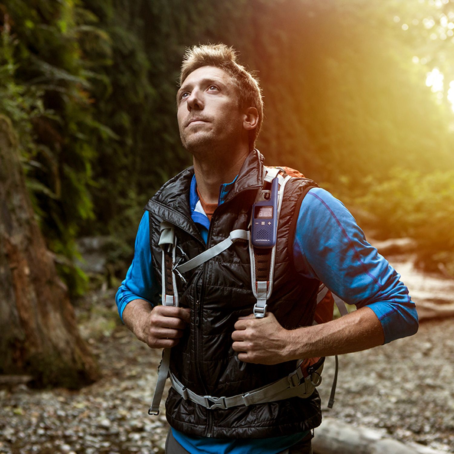 t383 (blue) walkie talkie on man hiking